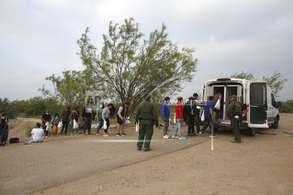 Dario Lopez-Mills Migrants who had crossed the Rio Grande river into the United States are taken away by U.S. Border Patrol agents in Eagle Pass, Texas, Friday, May 20, 2022. As U.S. officials anxiously waited, many of the migrants crossing the border from Mexico on Friday were oblivious to a pending momentous court ruling on whether to maintain pandemic-related powers that deny a chance to seek asylum on grounds of preventing the spread of COVID-19. (AP Photo/Dario Lopez-Mills)