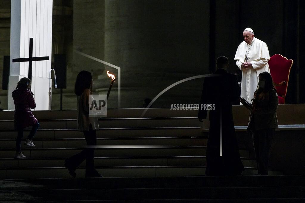 Angelo Carconi Pope Francis leads the Via Crucis (Way of the Cross) procession in the empty square outside the Saint Peter's Basilica during Good Friday celebrations at the Vatican, with no public participation due to the Coronavirus pandemic, Friday, April 2, 2021. (Angelo Carconi/Pool photo via AP)
