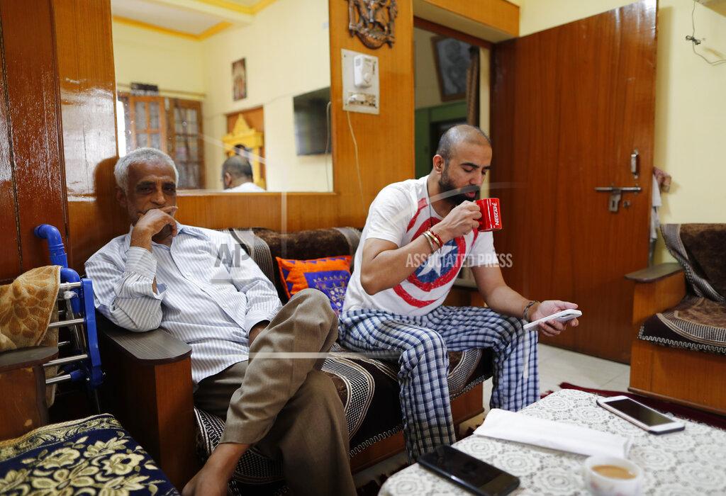 Rajesh Kumar Singh Radha Gobindo Pramanik sits beside his son-in-law days after both his wife and daughter died of the coronavirus in Lucknow, India, Friday June 4, 2021. Within days, Pramanisk's wife, his daughter and his unborn grandchild were among the tens of thousands killed as the coronavirus ravaged the country in April and May. As India emerges from its darkest days of the pandemic, families across the country are grieving all that they’ve lost and are left wondering if more could have been done to avoid this tragedy. (AP Photo/Rajesh Kumar Singh)