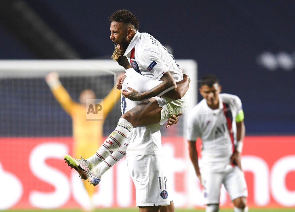 David Ramos PSG's Neymar celebrates with teammate Eric Maxim Choupo-Moting after his team's win in the Champions League quarterfinal match between Atalanta and PSG at Luz stadium, Lisbon, Portugal, Wednesday, Aug. 12, 2020. (David Ramos/Pool Photo via AP)