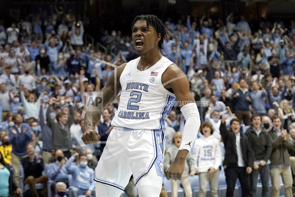 Gerry Broome North Carolina guard Caleb Love (2) reacts following a basket against Michigan during the first half of an NCAA college basketball game in Chapel Hill, N.C., Wednesday, Dec. 1, 2021. (AP Photo/Gerry Broome)