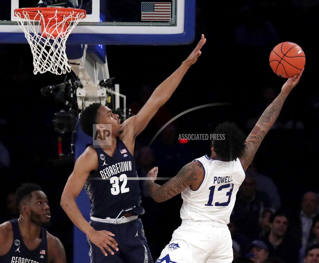 Julio Cortez Seton Hall guard Myles Powell (13) goes up for a shot against Georgetown guard Kaleb Johnson (32) during the second half of an NCAA college basketball game in the Big East men's tournament, Thursday, March 14, 2019, in New York. Seton Hall won 73-57. (AP Photo/Julio Cortez)