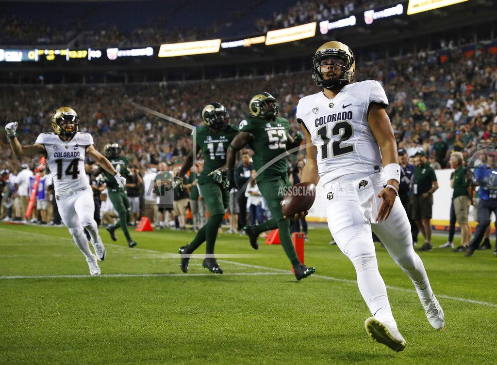 David Zalubowski Colorado quarterback Steven Montez, front, runs for a toucdown against Colorado State in the first half of an NCAA college football game Friday, Aug. 31, 2018, in Denver. (AP Photo/David Zalubowski)