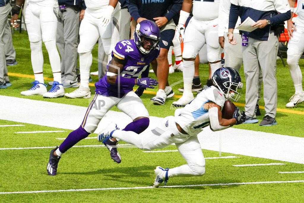 Jim Mone Tennessee Titans wide receiver Kalif Raymond catches a pass ahead of Minnesota Vikings defensive back Holton Hill (24) during the first half of an NFL football game, Sunday, Sept. 27, 2020, in Minneapolis. (AP Photo/Jim Mone)