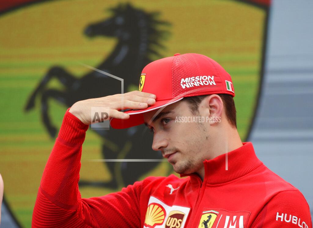 Luca Bruno Ferrari driver Charles Leclerc of Monaco gestures during an autographs session at the Monaco racetrack, in Monaco, Friday, May 24, 2019. The Formula one race will be held on Sunday. (AP Photo/Luca Bruno)