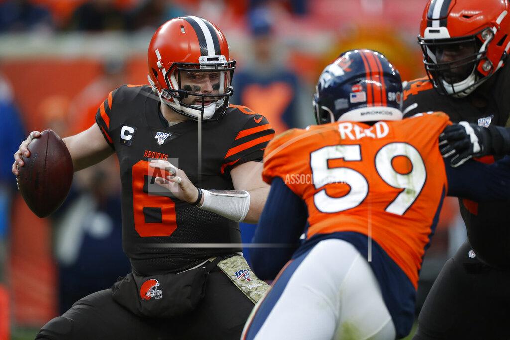 David Zalubowski Cleveland Browns quarterback Baker Mayfield (6) tries to elude Denver Broncos linebacker Malik Reed (59) during the second half of NFL football game, Sunday, Nov. 3, 2019, in Denver. (AP Photo/David Zalubowski)
