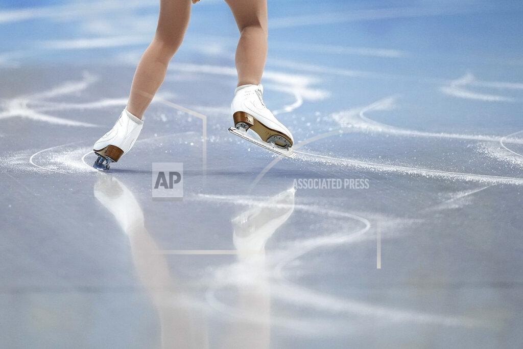 David J. Phillip A skater warms up ahead of the women's free skate program during the figure skating competition at the 2022 Winter Olympics, Thursday, Feb. 17, 2022, in Beijing. (AP Photo/David J. Phillip)