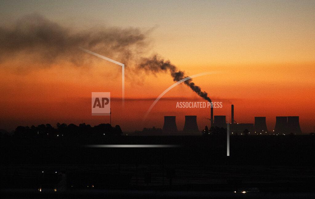 Themba Hadebe FILE - A coal-fired power station in Witbank, South Africa , Monday, Oct. 11, 2021. South Africans are struggling in the dark to cope with increased power cuts that have hit households and businesses across the country. The rolling power cuts have been experienced for years but this week the country’s state-owned power utility Eskom extended them so that some residents and businesses have gone without power for more than 9 hours a day. (AP Photo/Themba Hadebe, File)