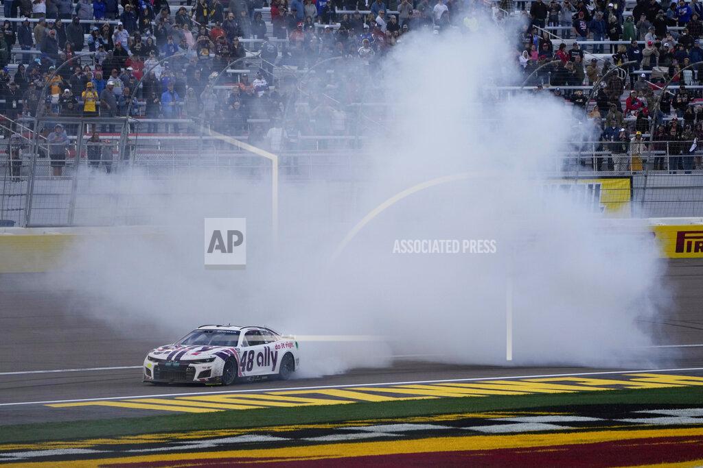 John Locher Alex Bowman (48) does a burnout after winning a NASCAR Cup Series auto race Sunday, March 6, 2022, in Las Vegas. (AP Photo/John Locher)