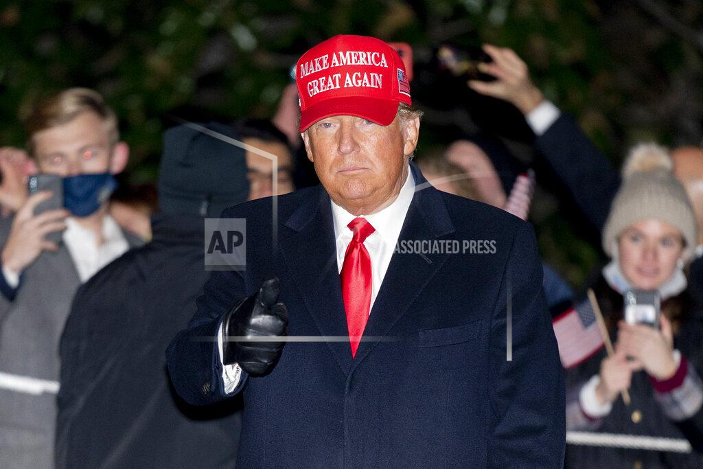 Patrick Semansky President Donald Trump gestures as he walks on the South Lawn of the White House in Washington, Tuesday, Nov. 3, 2020, after stepping off Marine One and greeting supporters. Trump is returning from campaign events in North Carolina, Pennsylvania, Michigan and Wisconsin. (AP Photo/Patrick Semansky)