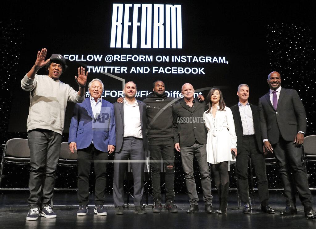 Kathy Willens FILE - In this Jan. 23, 2019, file photo, entrepreneur and recording artist Shawn "Jay-Z" Carter, from left, gestures as he poses with New England Patriots owner Robert Kraft, Philadelphia 76ers co-owner and Fanatics executive chairman Michael Rubin, recording artist Meek Mill, Galaxy Digital CEO and founder Michael Novogratz, Brooklyn Nets co-owner Clara Wu Tsai, Third Point CEO and founder Daniel S. Loeb, and REFORM Alliance CEO and political activist Van Jones after the group announced a partnership to transform the American criminal justice system, in New York. Police in Florida have charged New England Patriots owner Robert Kraft with misdemeanor solicitation of prostitution, saying they have videotape of him paying for a sex act inside an illicit massage parlor. Jupiter police told reporters Friday, Feb. 22, 2019, that the 77-year-old Kraft has not been arrested. (AP Photo/Kathy Willens, File)