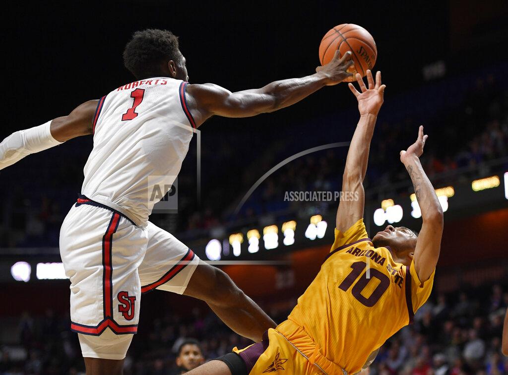 Jessica Hill St. John's Josh Roberts blocks a shot attempt by Arizona State's Jaelen House, right, during the first half of an NCAA college basketball game, Saturday, Nov. 23, 2019, in Uncasville, Conn. (AP Photo/Jessica Hill)