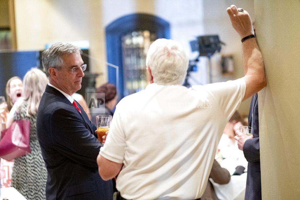 Ben Gray Incumbent Georgia Secretary of State Brad Raffensperger talks with a supporter during an election night party Tuesday evening, May 24, 2022 at a small restaurant in Peachtree Corners, Ga. (AP Photo/Ben Gray)