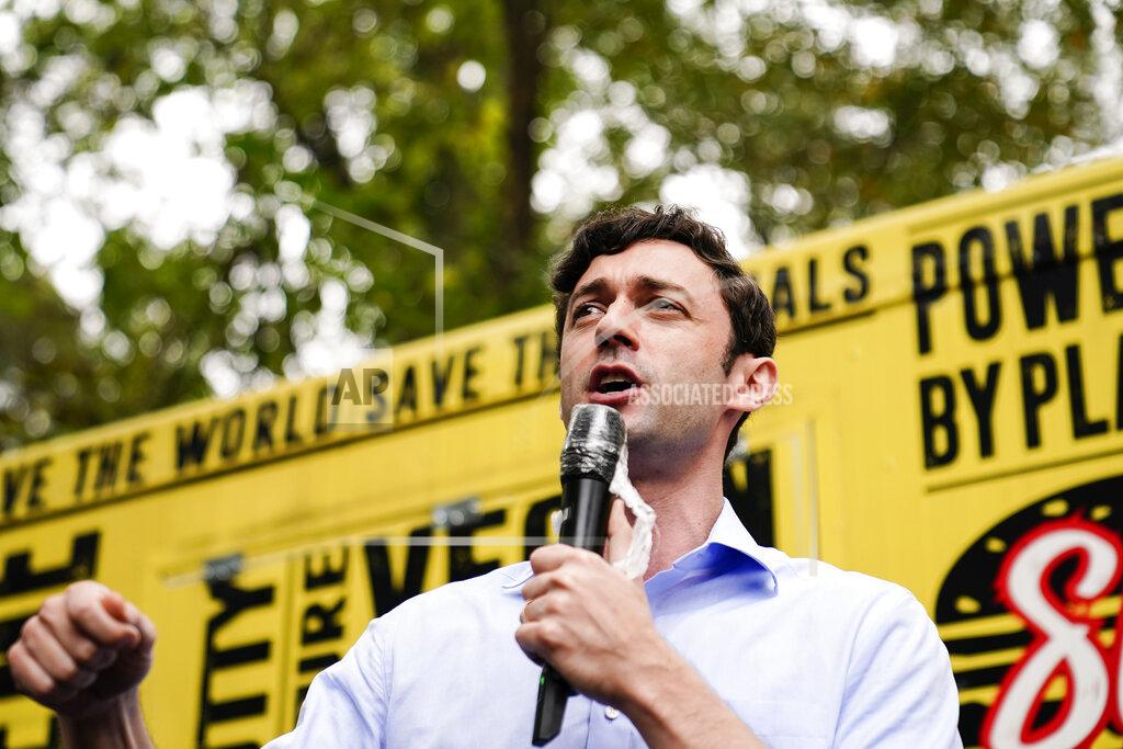 Brynn Anderson Democratic candidate for Senate Jon Ossoff speaks to a crowd during a "Get Out the Early Vote" event at the SluttyVegan ATL restaurant on Tuesday, Oct. 27, 2020, in Jonesboro, Ga. (AP Photo/Brynn Anderson)