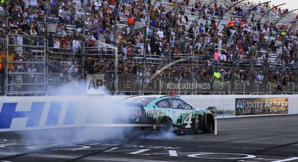 Charles Krupa Kevin Harvick smokes his tires for fans after winning a NASCAR Cup Series auto race at New Hampshire Motor Speedway in Loudon, N.H., Sunday, July 21, 2019. (AP Photo/Charles Krupa)