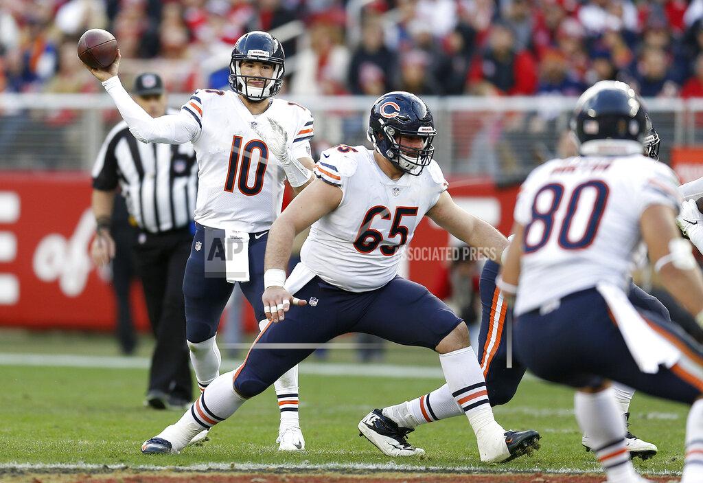 D. Ross Cameron FILE - In this Dec. 23, 2018, file photo, Chicago Bears quarterback Mitchell Trubisky (10) passes behind the blocking of center Cody Whitehair (65) during the second half of an NFL football game against the San Francisco 49ers in Santa Clara, Calif. Some might argue the center is the most indispensable player on the roster, the player who mans the only position guaranteed to touch the ball on every play. He calls the shots for the line and gets the action going.(AP Photo/D. Ross Cameron, File)