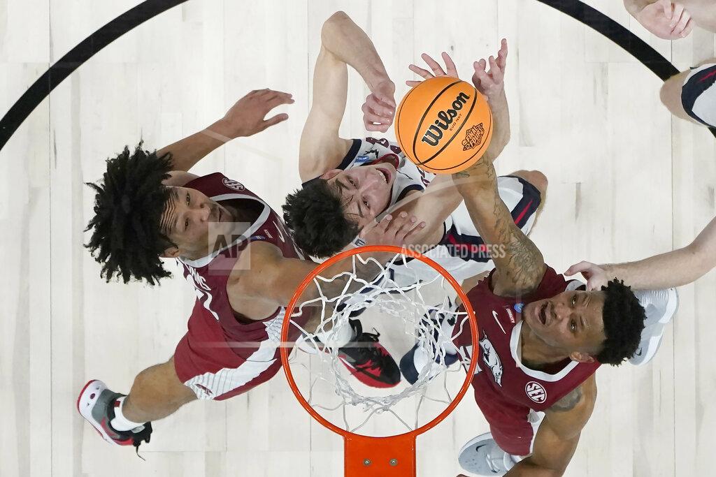 Marcio Jose Sanchez Arkansas guard Au'Diese Toney, right, scores over Gonzaga center Chet Holmgren, middle, during the second half of a college basketball game in the Sweet 16 round of the NCAA tournament in San Francisco, Thursday, March 24, 2022. Also pictured is Arkansas' Jaylin Williams, left. (AP Photo/Marcio Jose Sanchez)