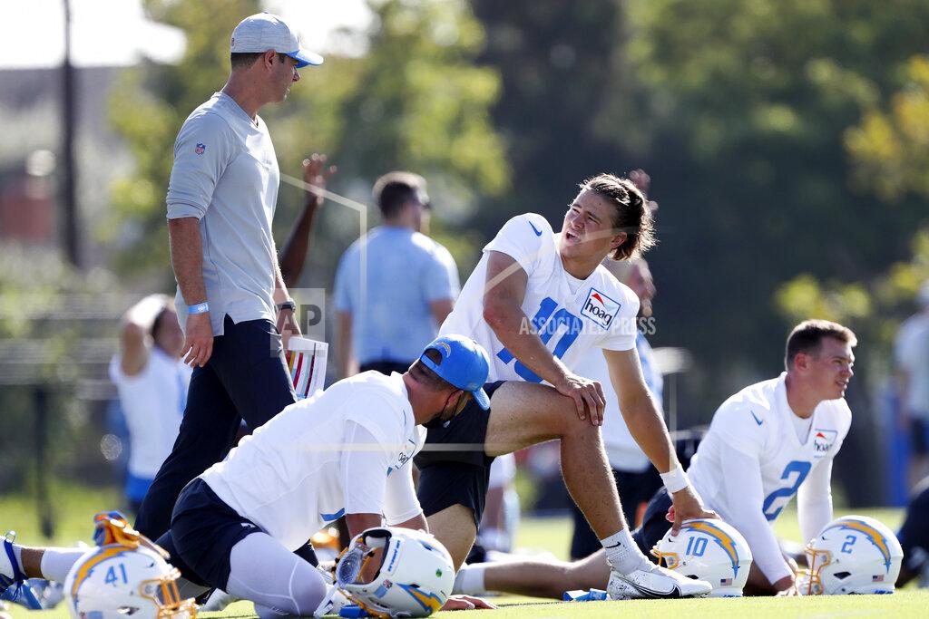 Alex Gallardo Los Angeles Chargers quarterback Justin Herbert (10) talks with head coach Brandon Staley during practice at the NFL football team's training camp in Costa Mesa, Calif., Wednesday, July 28, 2021. (AP Photo/Alex Gallardo)