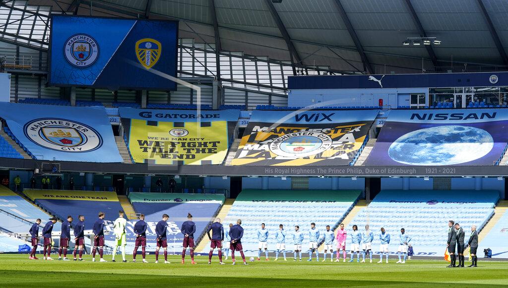 Tim Keeton Players and match officials stand for two minutes silence prior to kick off to mark the passing of Prince Philip at the age of 99 during the English Premier League soccer match between Manchester City and Leeds United at Etihad Stadium, Manchester, England, Saturday April 10, 2021.(AP Photo/Tim Keeton,Pool)