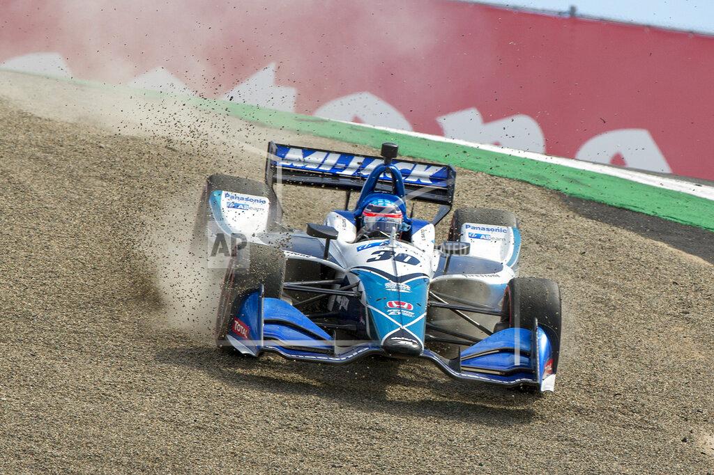 David Royal Takuma Sato (30) drives back onto the track after missing the turn at the top of The Corkscrew during an IndyCar auto race at Laguna Seca Raceway in Monterey, Calif., Sunday, Sept. 22, 2019. (AP Photo/David Royal)