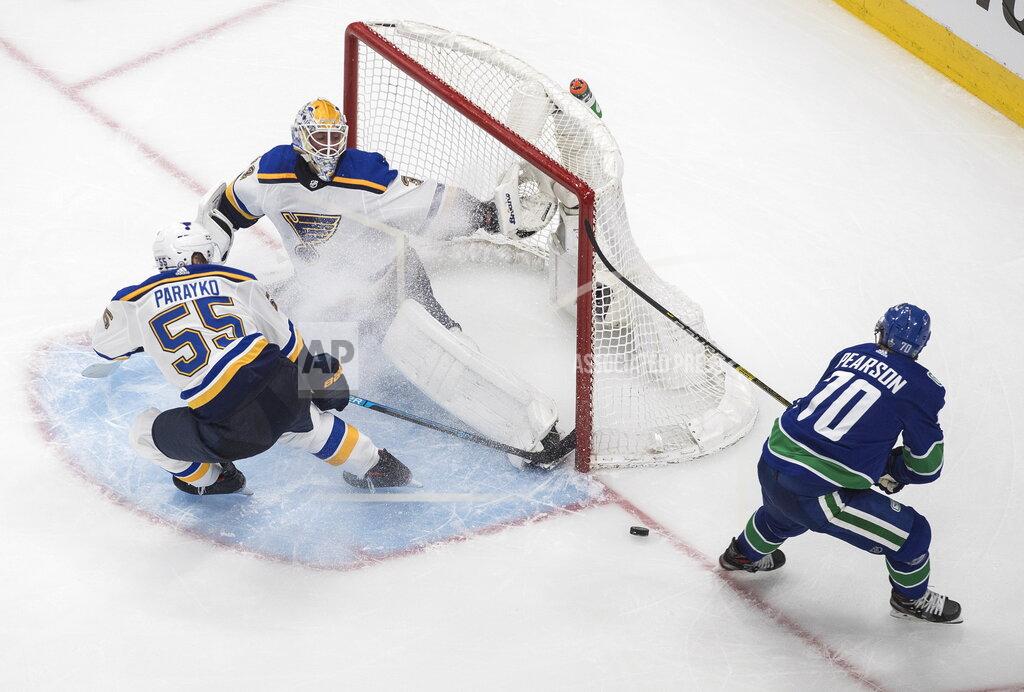Jason Franson Vancouver Canucks' Tanner Pearson (70) is stopped by St. Louis Blues goalie Jake Allen (34) as Colton Parayko (55) defends during the second period of an NHL Western Conference Stanley Cup playoff series, in Edmonton, Alberta, Friday, Aug. 21, 2020. (Jason Franson/The Canadian Press via AP)