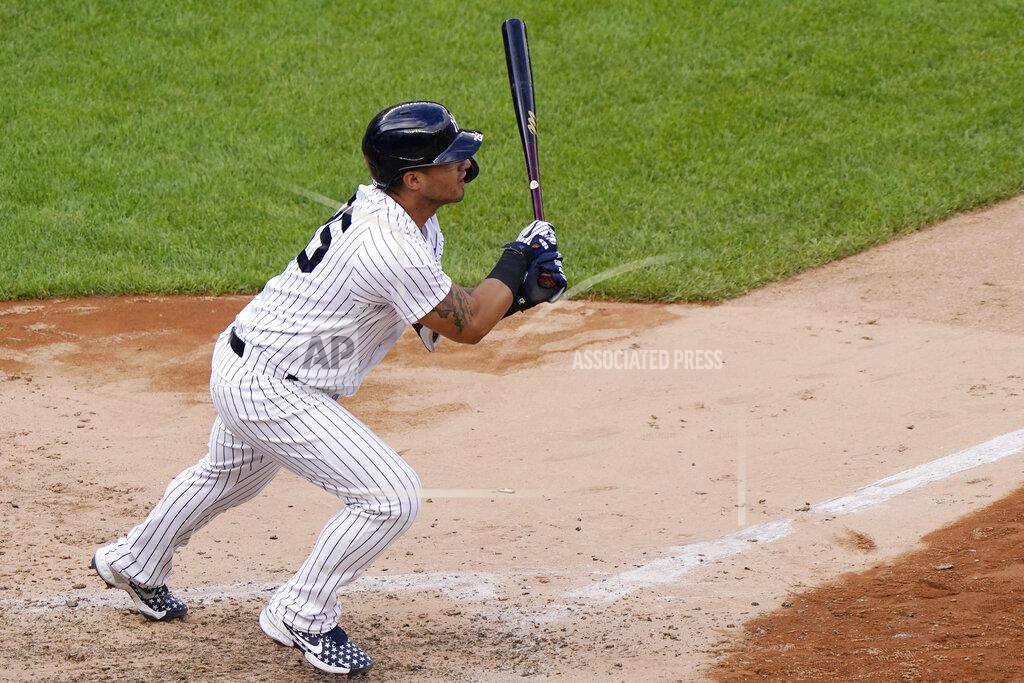 New York Yankees pinch hitter Gleyber Torres follows through on a two-run double to center field in the eighth inning of a baseball game against the Baltimore Orioles, Sunday, Sept. 13, 2020, at Yankee Stadium in New York. (AP Photo/Kathy Willens)