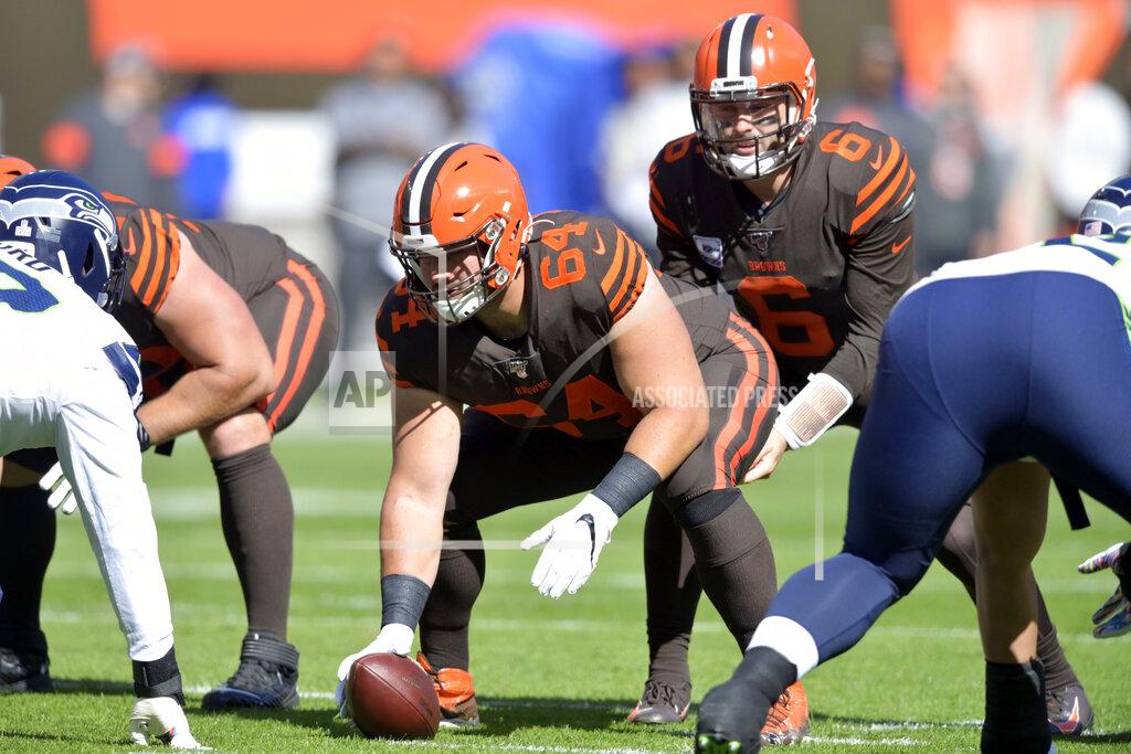 David Richard FILE - In this Oct. 13, 2019, file photo, Cleveland Browns center JC Tretter (64) lines up during an NFL football game against the Seattle Seahawks, in Cleveland. A person familiar with the negotiations says Browns' Tretter has agreed to terms on a three-year, $32.5 million contract extension with the club. Tretter, who is in his third season with the team, will receive $23 million guaranteed, said the person who spoke on condition of anonymity because the deal has not been finalized. An announcement could come Friday, Nov. 8, 2019, the person said. (AP Photo/David Richard, File)