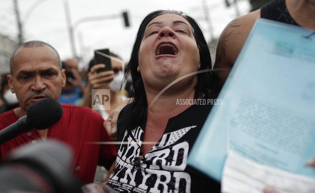 Silvia Izquierdo The relative of a victim shouts against the police during a protest one day after a deadly police operation in the Jacarezinho favela in Rio de Janeiro, Brazil, Friday, May 7, 2021. A bloody, hours-long gunbattle here echoed into Friday, with authorities saying the police mission killed two dozen criminals while residents and activists claimed human rights abuses. (AP Photo/Silvia Izquierdo)