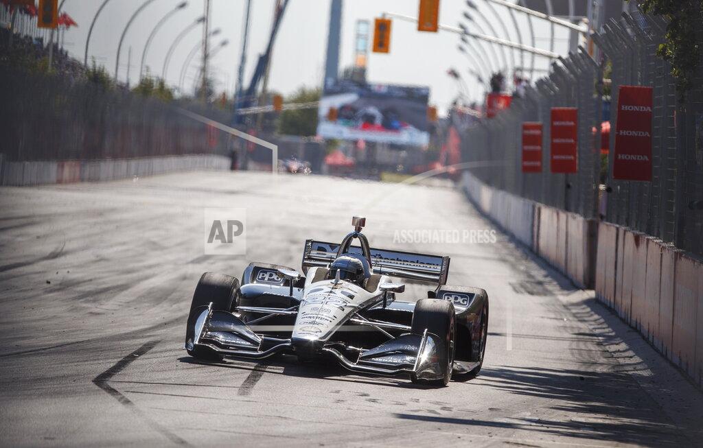 Mark Blinch Simon Pagenaud, of France, drives his way to first place at the Honda Indy auto race in Toronto, Sunday, July 14, 2019. (Mark Blinch/The Canadian Press via AP)