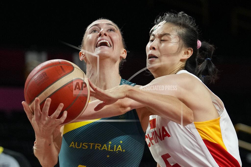 Eric Gay Australia's Katie Ebzery, left, is fouled by China's Siyu Wang, right, during a women's basketball preliminary round game at the 2020 Summer Olympics in Saitama, Japan, Friday, July 30, 2021. (AP Photo/Eric Gay)