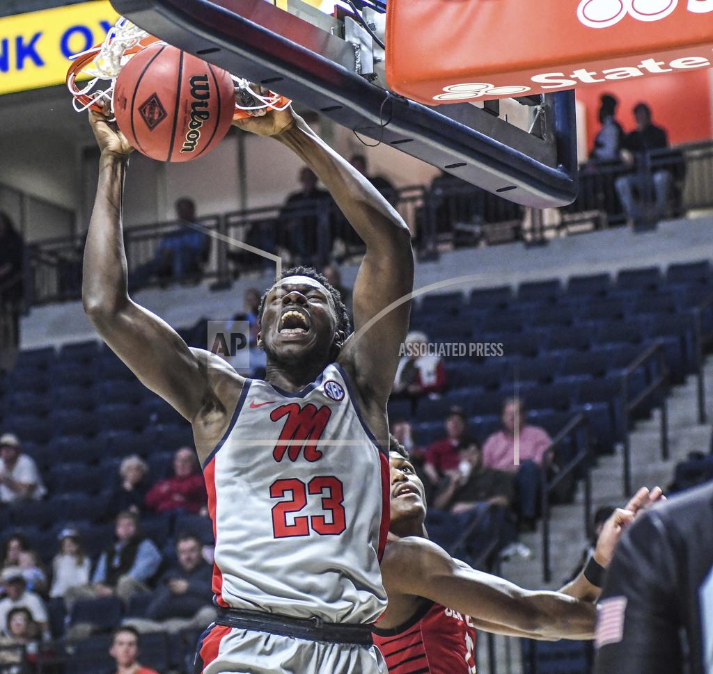 Bruce Newman Mississippi forward Sammy Hunter (23) dunks next to Seattle guard Morgan Means (13) during an NCAA college basketball game Tuesday, Nov. 19, 2019, in Oxford, Miss. (Bruce Newman/The Oxford Eagle via AP)