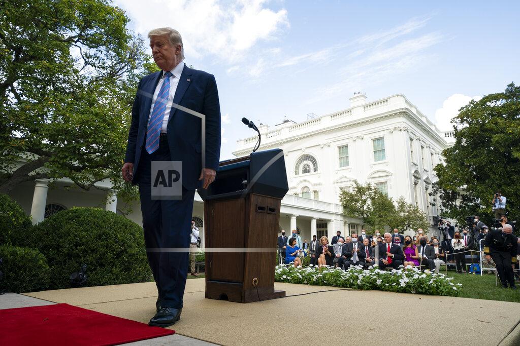 Evan Vucci President Donald Trump leaves after an event about coronavirus testing strategy, in the Rose Garden of the White House, Monday, Sept. 28, 2020, in Washington. (AP Photo/Evan Vucci)