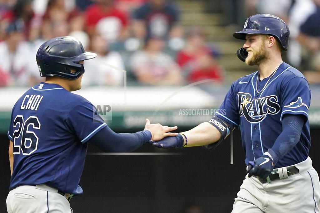 Tony Dejak Tampa Bay Rays' Austin Meadows, right, is congratulated by Ji-Man Choi after Meadows hit a two-run home run during the third inning of the team's baseball game against the Cleveland Indians, Saturday, July 24, 2021, in Cleveland. (AP Photo/Tony Dejak)