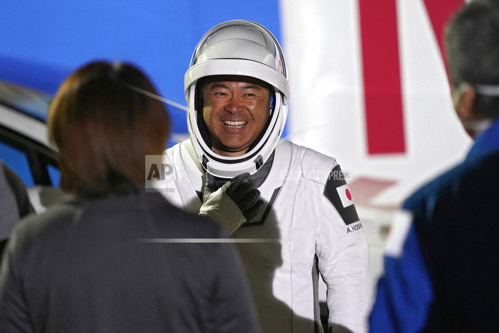 John Raoux Japan Aerospace Exploration Agency astronaut Akihiko Hoshide smiles as he talks to family and friends after leaving the operations and checkout building before a launch attempt Friday, April 23, 2021, at the Kennedy Space Center in Cape Canaveral, Fla. Four astronauts will fly on the SpaceX Crew mission to the International Space Station scheduled for launch on April 23, 2021. (AP Photo/John Raoux)