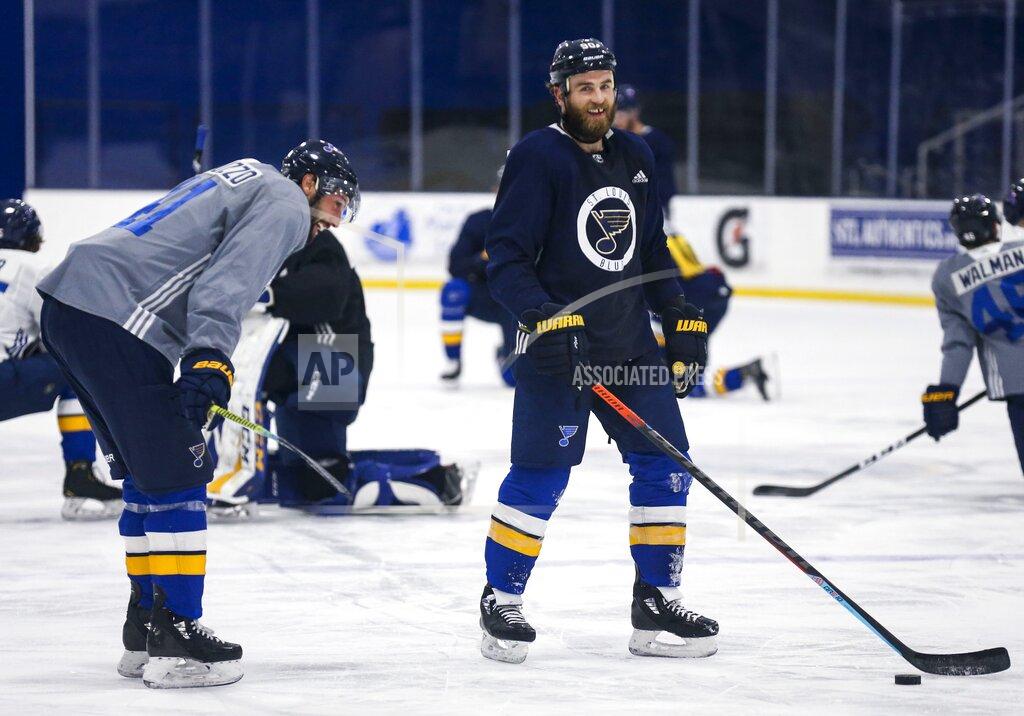 Colter Peterson St. Louis Blues center Ryan O'Reilly (90) and Blues defenseman Robert Bortuzzo (41) joke around after NHL hockey practice at the Centene Community Ice Center in Maryland Heights, Mo., Monday, Jan. 4, 2021. (Colter Peterson/St. Louis Post-Dispatch via AP)