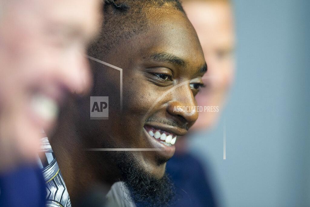 Shaban Athuman Dallas Cowboys defensive end Demarcus Lawrence, center, laughs during a press conference at The Star in Frisco, Texas, Tuesday, April 9, 2019. DeMarcus Lawrence may not be the highest-paid Dallas Cowboys player in history for long. It doesn’t mean the club’s best defensive end can’t enjoy the distinction while it lasts. The 26-year-old Lawrence signed a $105 million, five-year contract Tuesday.(Shaban Athuman/The Dallas Morning News via AP)