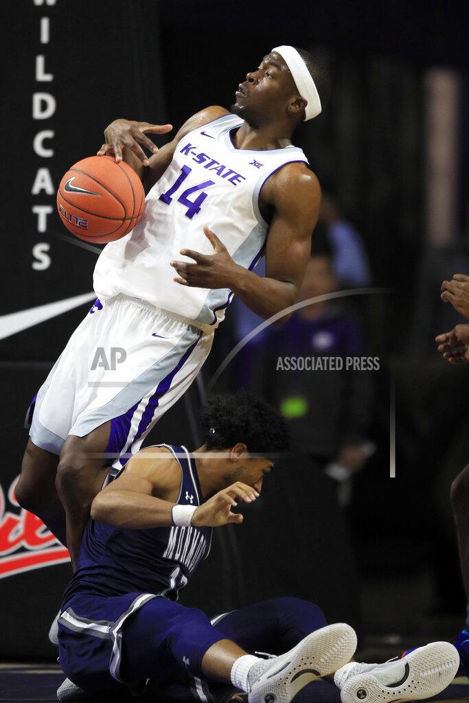 Orlin Wagner Kansas State forward Makol Mawien (14) rebounds next to Monmouth guard Marcus McClary, bottom, during the first half of an NCAA college basketball game in Manhattan, Kan., Wednesday, Nov. 13, 2019. (AP Photo/Orlin Wagner)