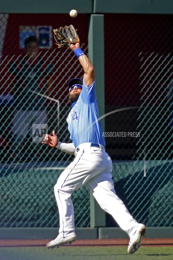 Charlie Riedel Kansas City Royals left fielder Alex Gordon catches a fly ball for the out on Cincinnati Reds' Mike Moustakas during the second inning of game one of a baseball doubleheader Wednesday, Aug. 19, 2020, in Kansas City, Mo. (AP Photo/Charlie Riedel)