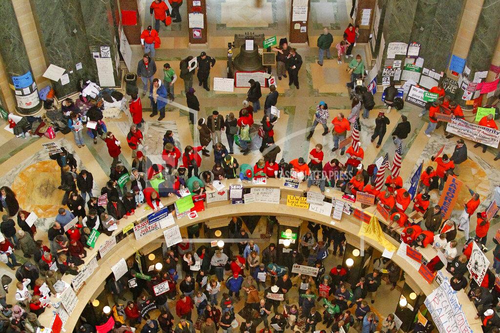 Jeffrey Phelps FILE - In this Tuesday, Feb. 22, 2011 file photo, pro-labor protesters bang drums and chant inside the state Capitol in Madison, Wis., during their eighth day of protesting. On Friday, Feb. 5, 2021, The Associated Press reported on a photo circulating online incorrectly asserting it shows Democratic protesters storming the U.S. Capitol during the confirmation of then-Supreme Court nominee Brett Kavanaugh in 2018. That photo is being misrepresented. It was taken in February 2011 at the state Capitol in Madison, during labor demonstrations against to protest a proposal that would effectively strip union workers of collective bargaining rights. (AP Photo/Jeffrey Phelps)