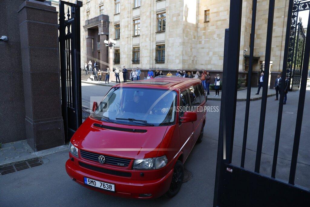 Pavel Golovkin Embassy staff leave the Czech Republic Embassy by car, in Moscow, Russia, Monday, April 19, 2021. Russia has ordered 20 Czech diplomats to leave the country within a day in response to Prague's expulsion of 18 Russian diplomats. The Czech government has alleged the Russian Embassy staffers were spies for a military intelligence agency that was involved in a fatal ammunition depot explosion in 2014. (AP Photo/Pavel Golovkin)