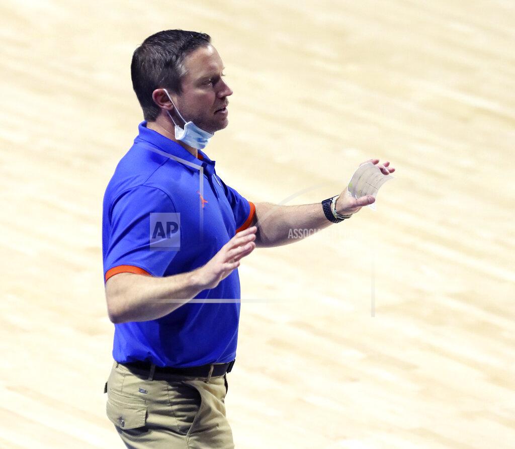 Brad Mcclenny Florida head coach Mike White talks to his players on the sideline during an NCAA college basketball game against Missouri Wednesday, March 3, 2021 in Gainesville, Fla. (Brad McClenny/The Gainesville Sun via AP)