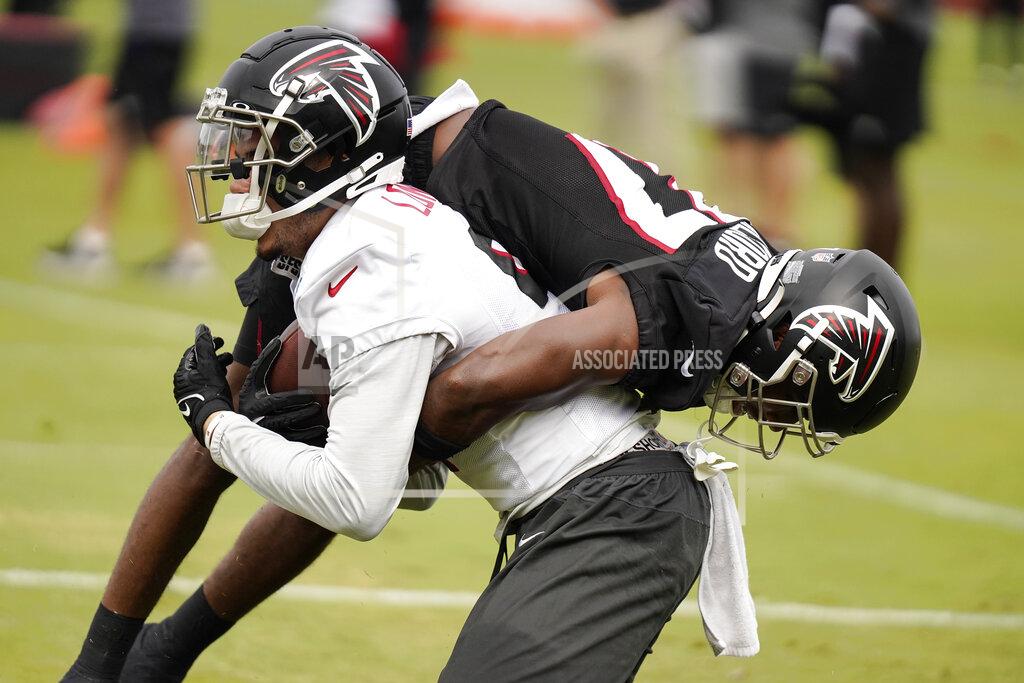 Brynn Anderson Atlanta Falcons wide receiver Drake London lifts Atlanta Falcons defensive back Dee Alford as they take part in drills at the NFL football team's practice facility on Saturday, July 30, 2022, in Flowery Branch, Ga. (AP Photo/Brynn Anderson)