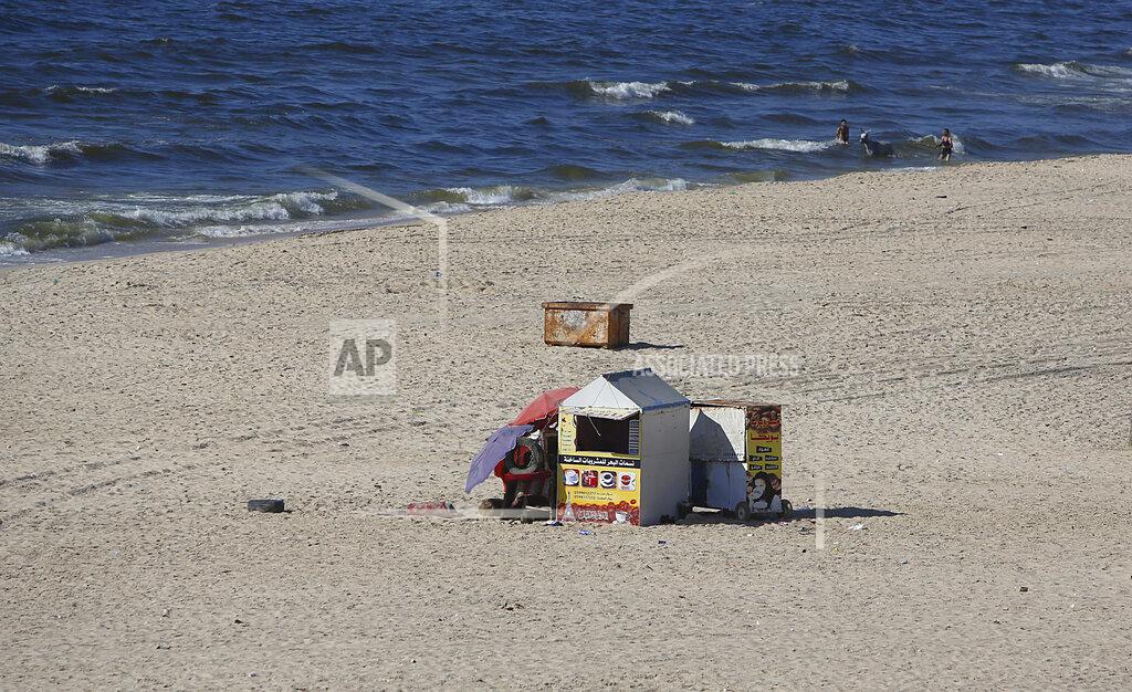 Hatem Moussa A beach is almost empty during a lockdown after a 48 hour lockdown was imposed following the discovery of the first local coronavirus cases in the Gaza Strip, Wednesday, Aug. 26, 2020. (AP Photo/Hatem Moussa)