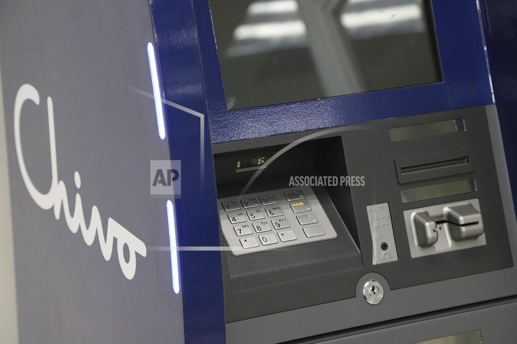 Salvador Melendez A government-run Chivo machine that will soon exchange cash for dispense Bitcoin cryptocurrency stands in a booth of the state-owned Banco Hipotecario, in San Salvador, El Salvador, Wednesday, Sept. 1, 2021. Starting Tuesday, Sept. 7, all businesses will have to accept payments in Bitcoin, except those lacking the technology to do so. (AP Photo/Salvador Melendez)