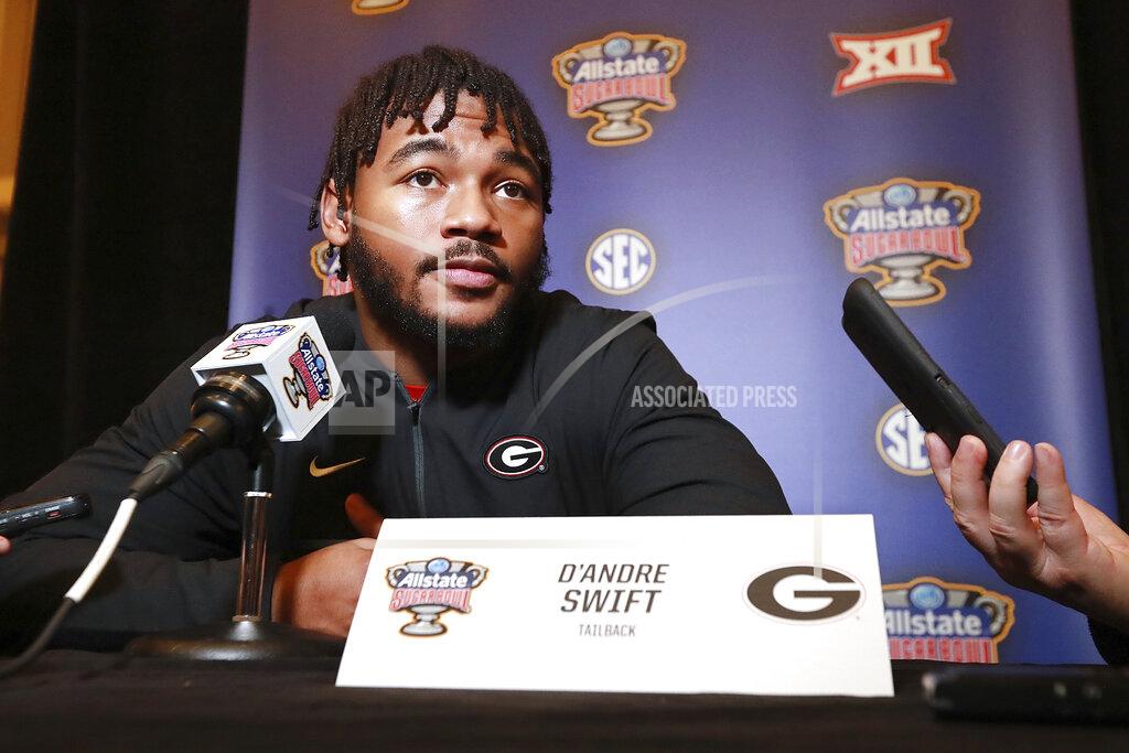 Curtis Compton Georgia tailback D'Andre Swift, who has been injured and may or may not play in the game, takes questions from the media during the Georgia Offense press conference for the Sugar Bowl against Baylor on Sunday, December 29, 2019, in New Orleans. (Curtis Compton/Atlanta Journal-Constitution via AP)