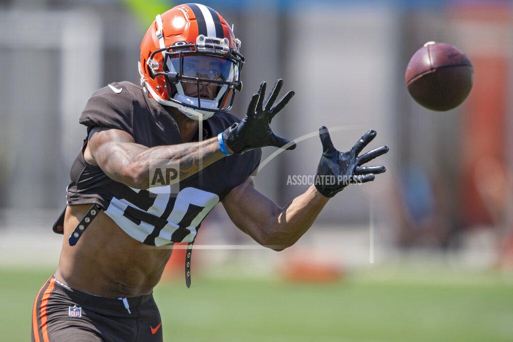 Cleveland Browns defensive back Greg Newsome II catches a football during an NFL football practice in Berea, Ohio, Wednesday, Aug. 4, 2021. (AP Photo/David Dermer)