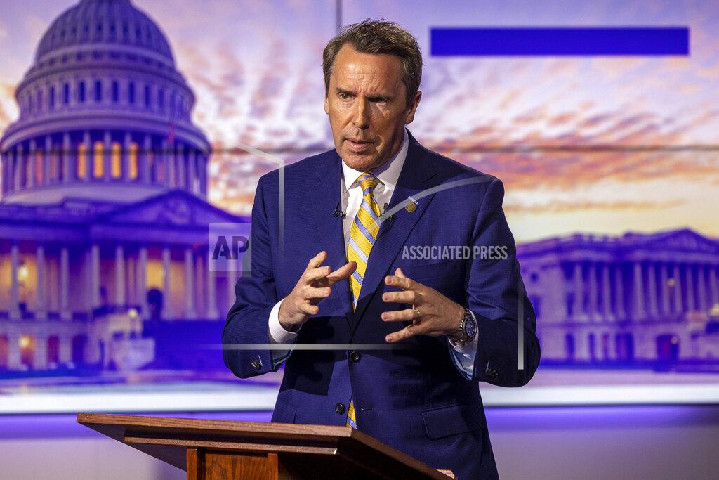Travis Long Republican U.S. Senate candidate Mark Walker answers a question during an hour-long debate moderated by Spectrum News political anchor Tim Boyum at the Spectrum News studio in Raleigh, N.C. Wednesday, April 20, 2022. (Travis Long/The News & Observer via AP)