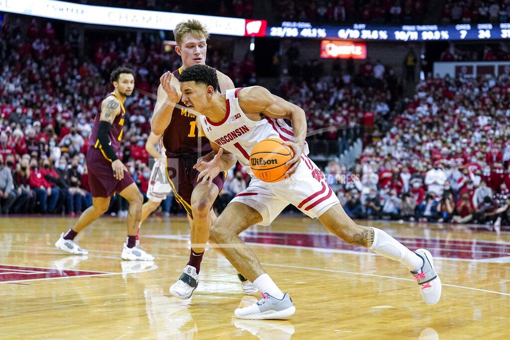 Andy Manis Wisconsin's Johnny Davis (1) drives against Minnesota's Jackson Purcell (11) during the second half of an NCAA college basketball game Sunday, Jan. 30, 2022, in Madison, Wis. Wisconsin won 66-60. (AP Photo/Andy Manis)