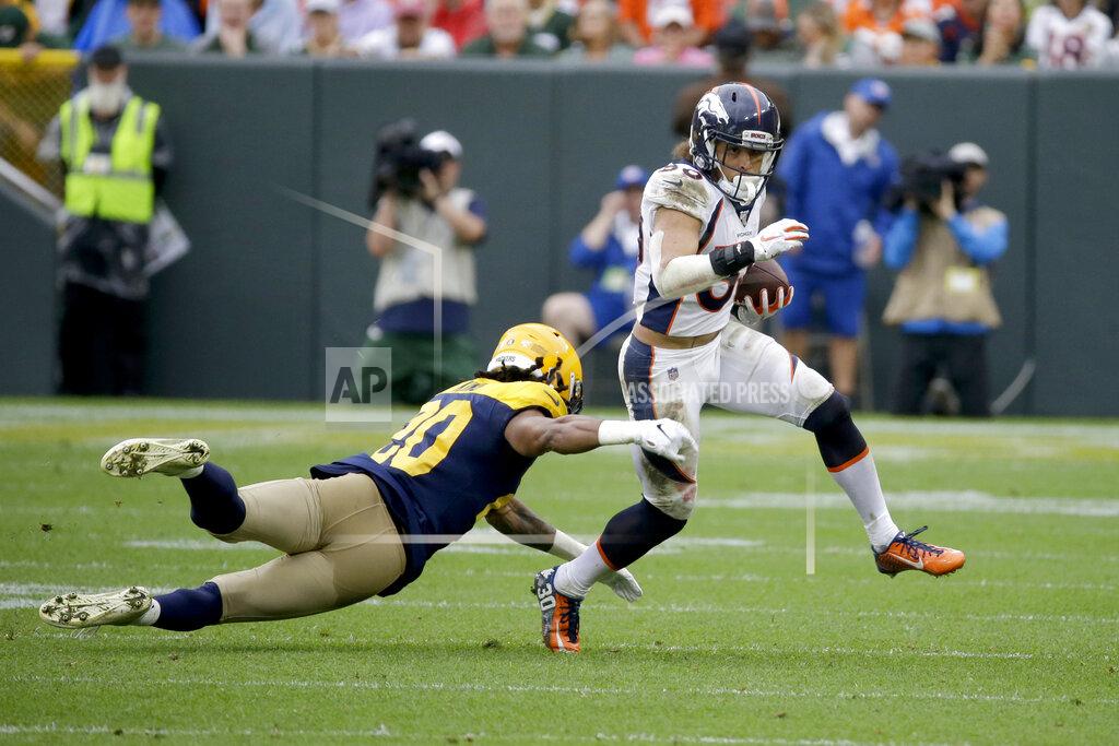 Mike Roemer Denver Broncos running back Phillip Lindsay, right, runs with the ball as Green Bay Packers cornerback Kevin King (20) defends during the second half of an NFL football game Sunday, Sept. 22, 2019, in Green Bay, Wis. (AP Photo/Mike Roemer)