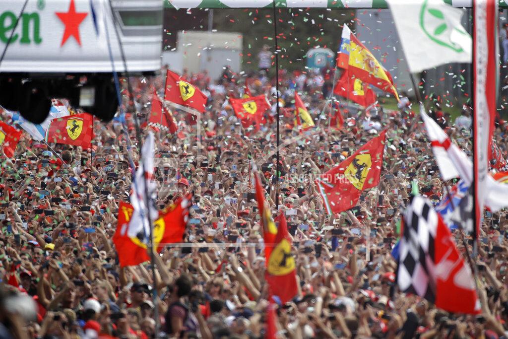 Luca Bruno Ferrari fans celebrates after Ferrari driver Charles Leclerc of Monaco winning the Formula One Italy Grand Prix at the Monza racetrack, in Monza, Italy, Sunday, Sept. 8, 2019. (AP Photo/Luca Bruno)